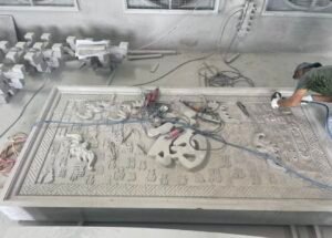 Handcrafted traditional Chinese stone carving details on a custom temple relief wall