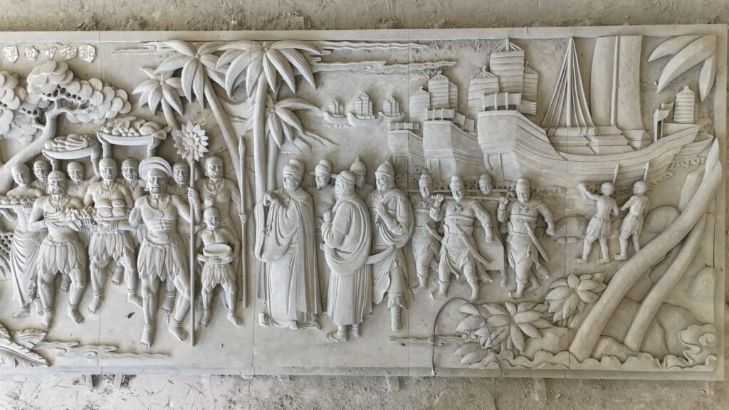 Close-up of Zheng He maritime custom stone sculptures relief.
